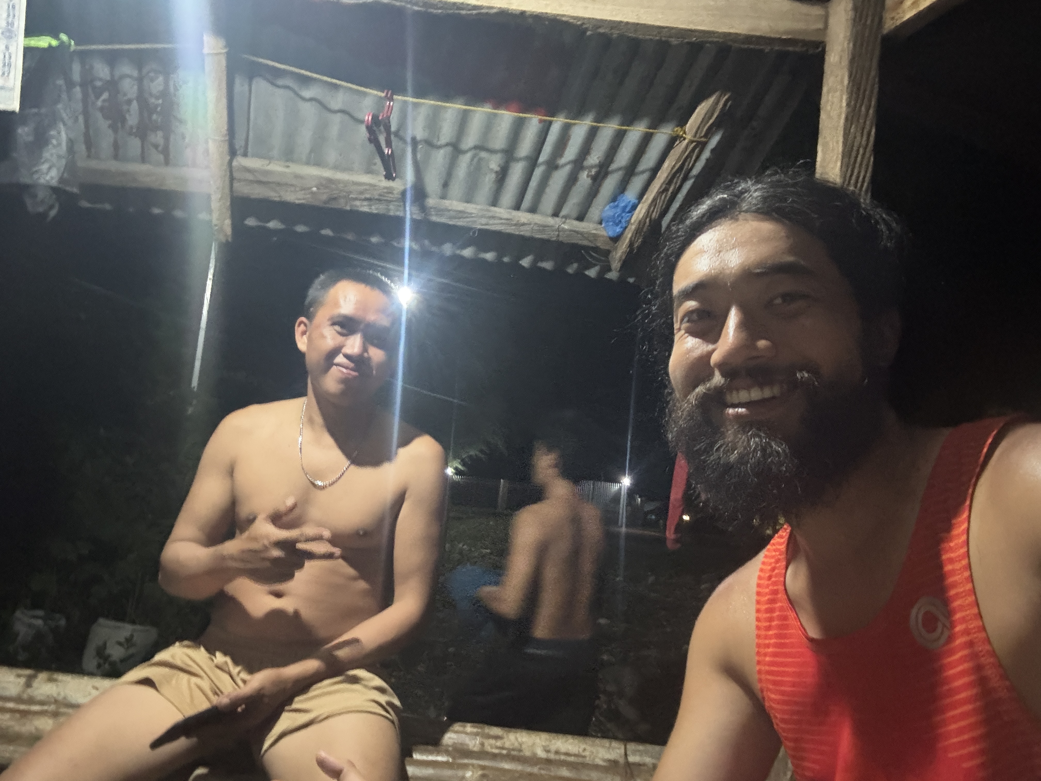 Resting with a group of local construction workers at their dormitory