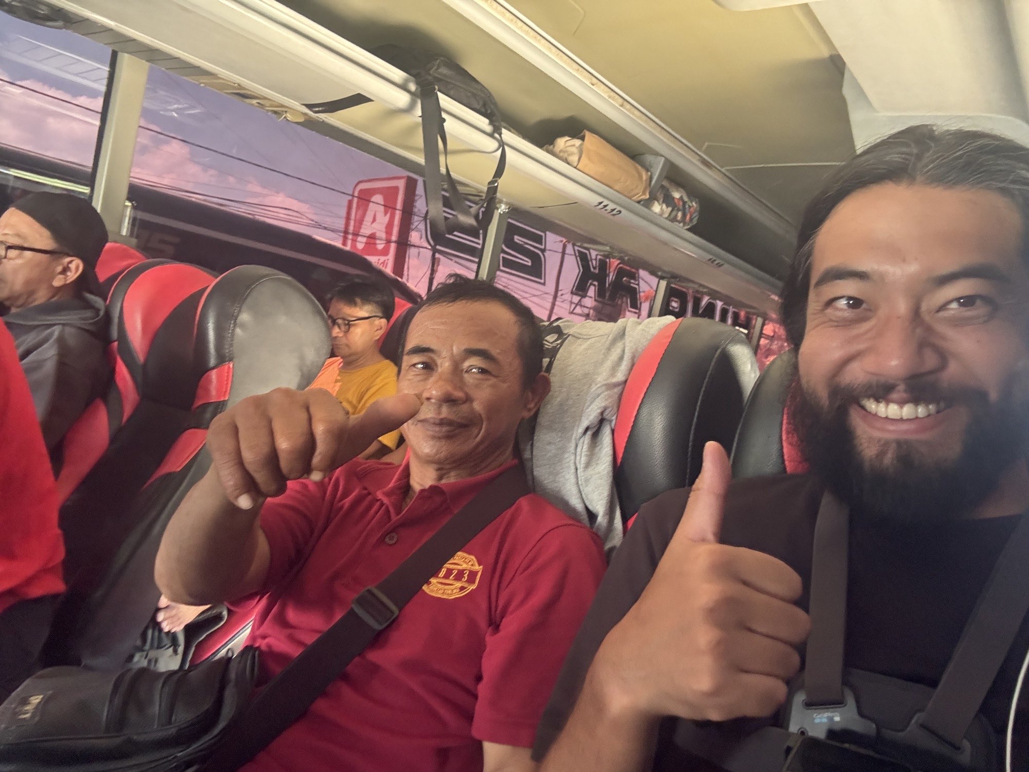 A cheerful selfie with my friendly seat neighbor on the bus