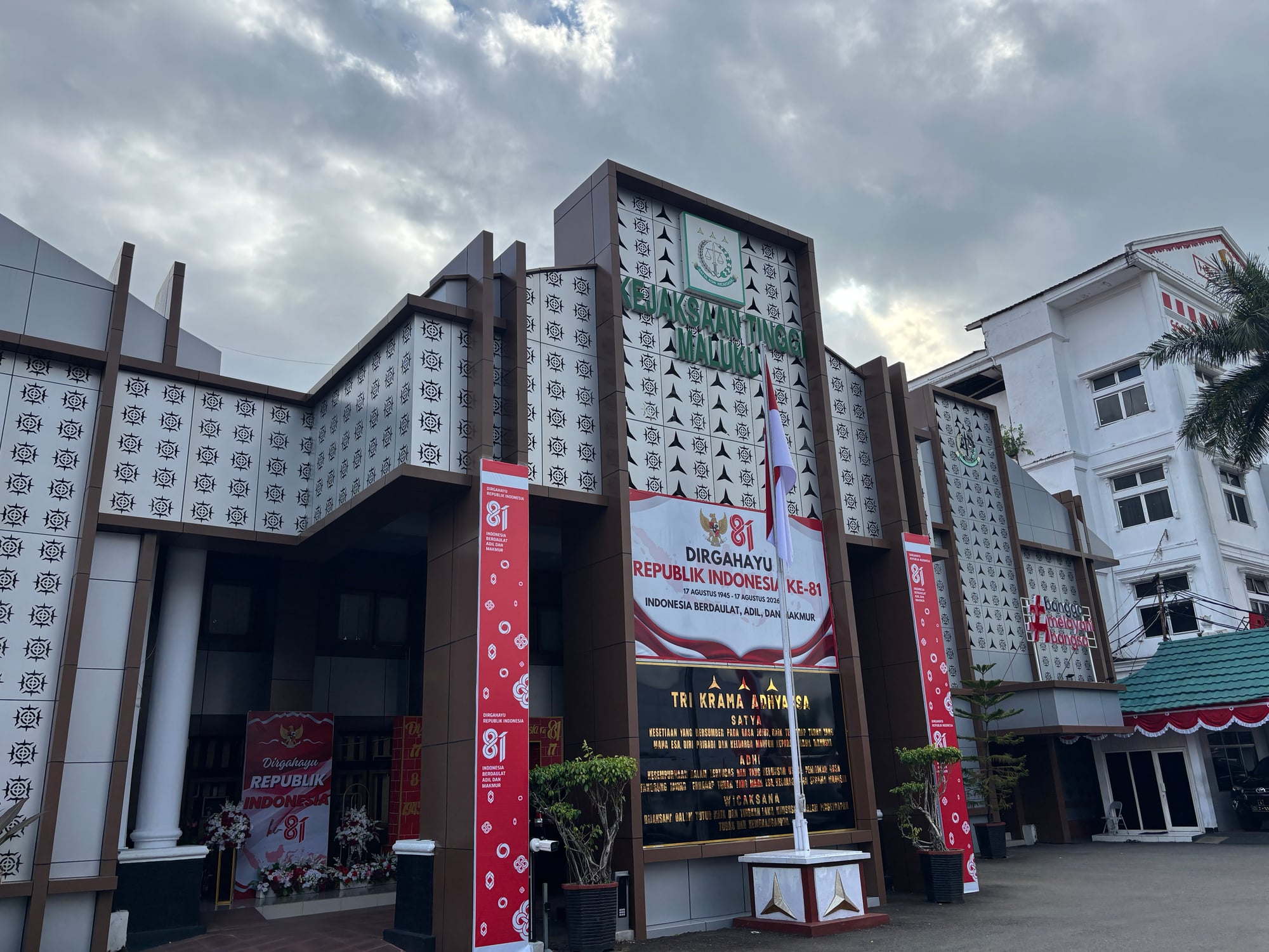 A building facade decorated with Timor cultural patterns and Independence Day banners