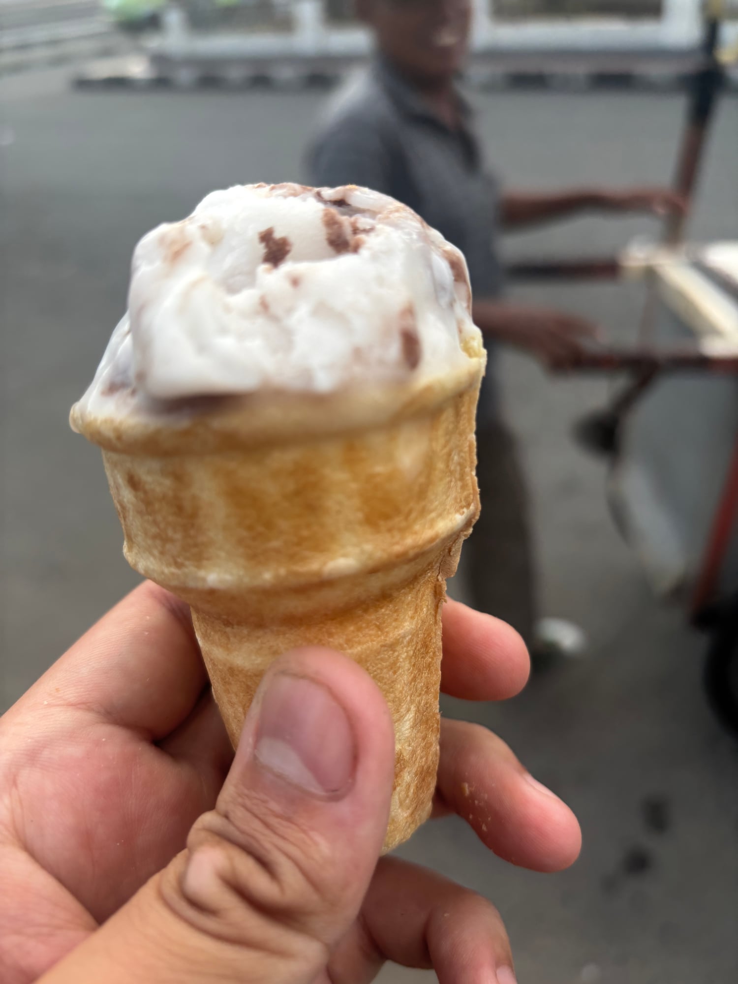 A cone of Es Puter, traditional coconut milk ice cream