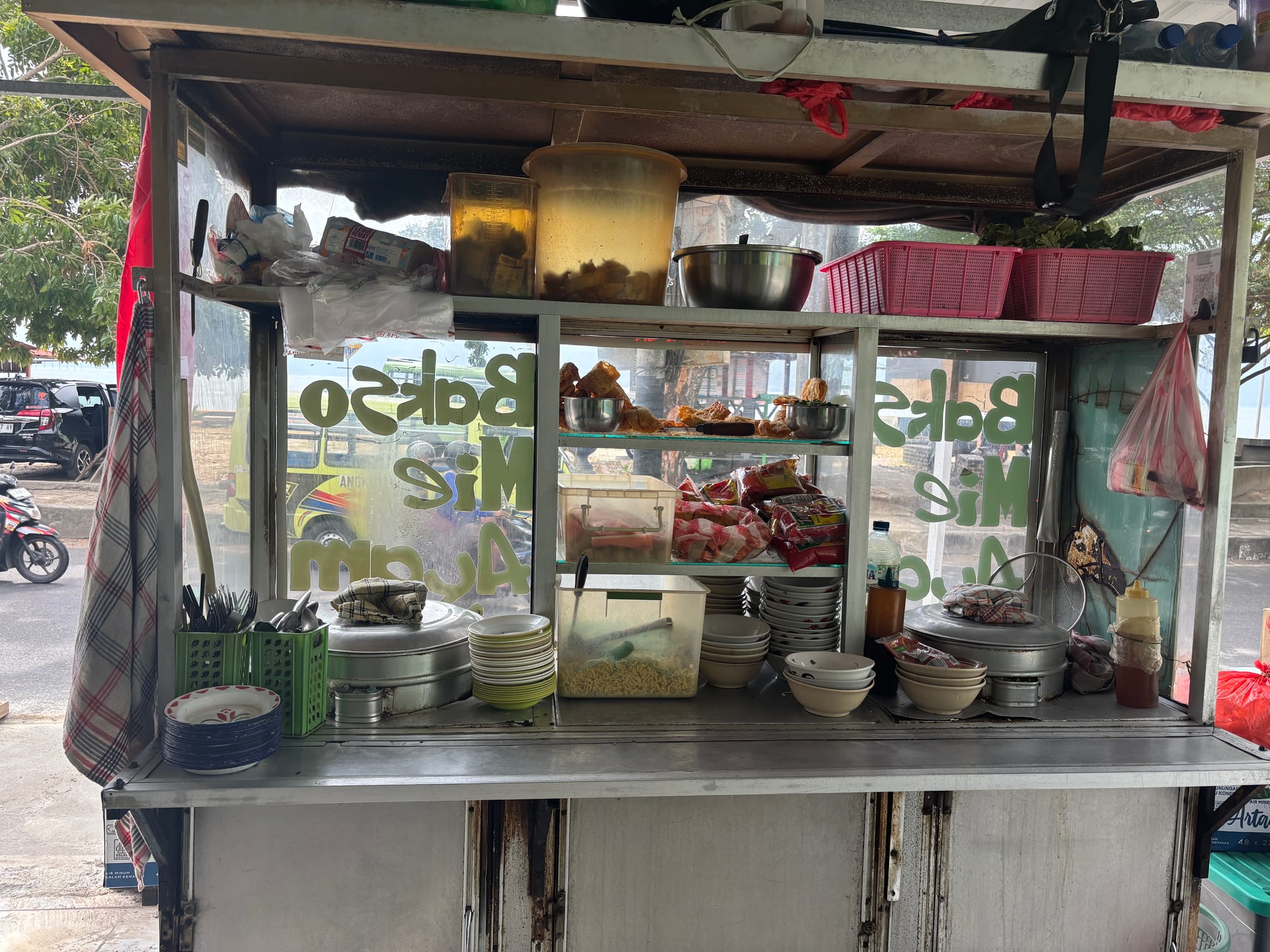 A street stall selling Bakso and Mie Ayam noodle dishes