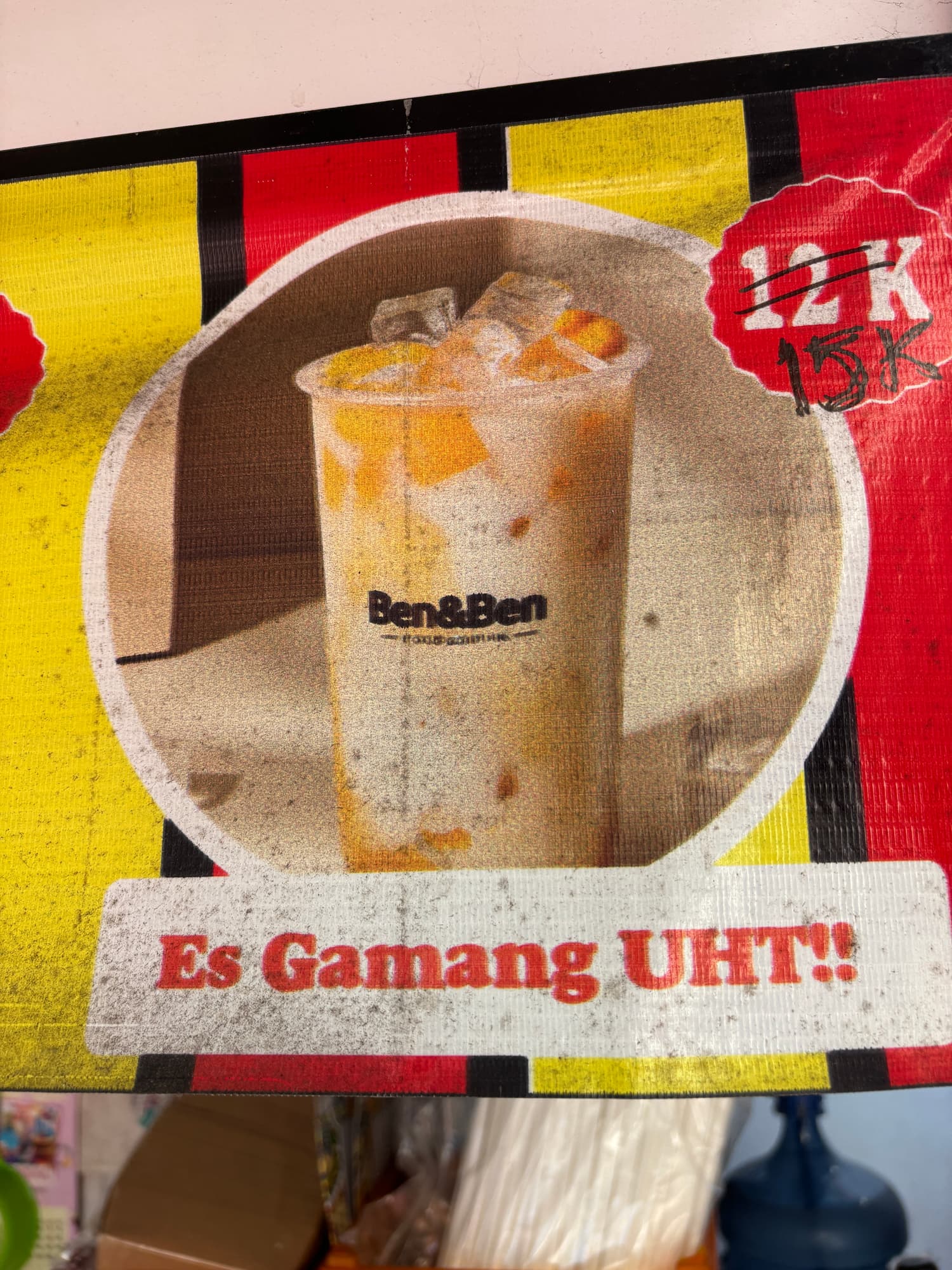 A drink stand banner advertising Es Gamang UHT mango juice