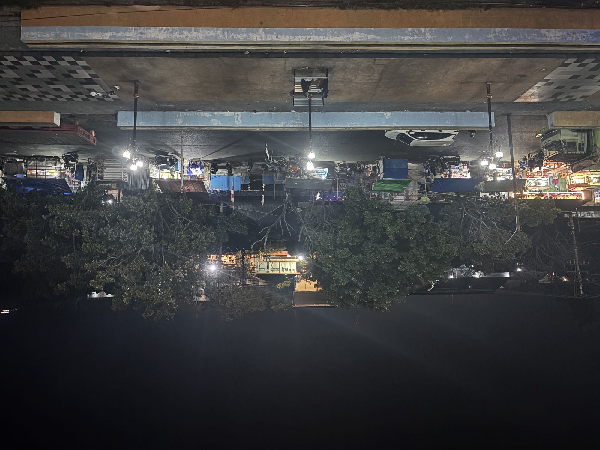 The bustling night market streets of Bitung, still lively late at night