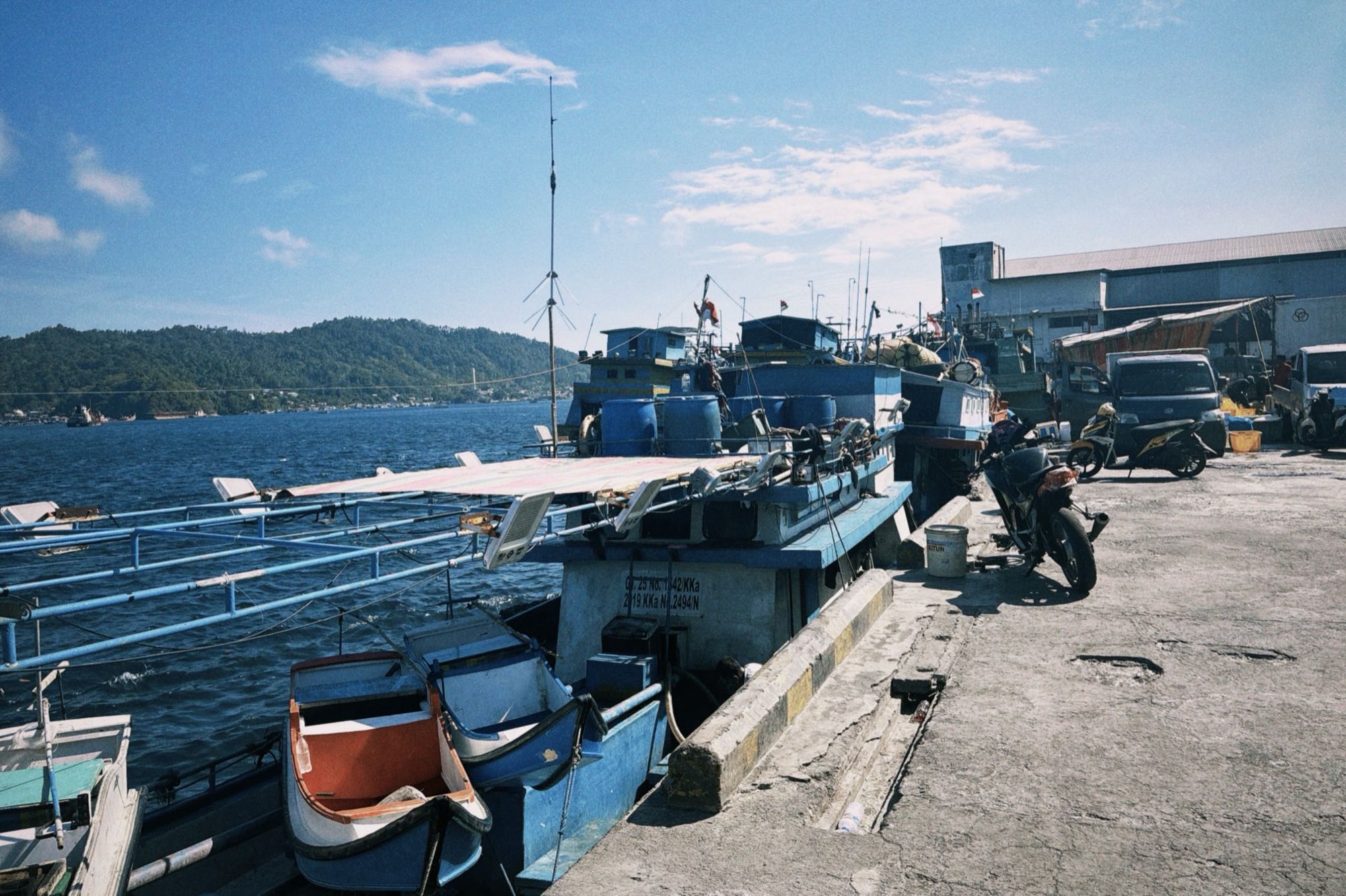 Fishing boats docked at the lively harbor in Bitung