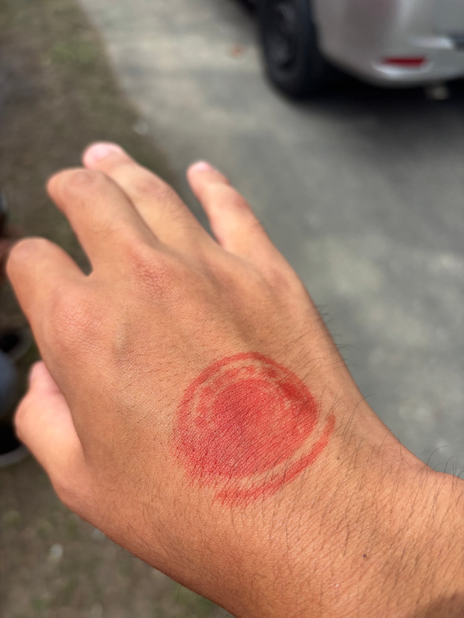 An ink stamp on my hand marking festival entry
