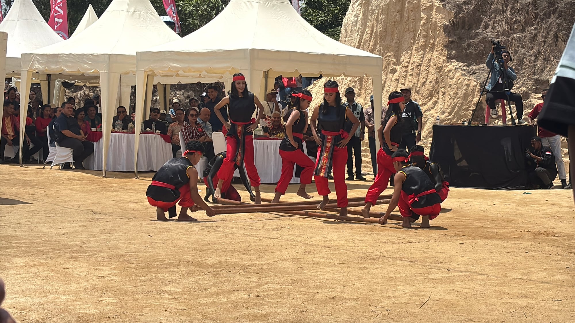 Dancers performing the Tari Saureka-Reka bamboo pole dance