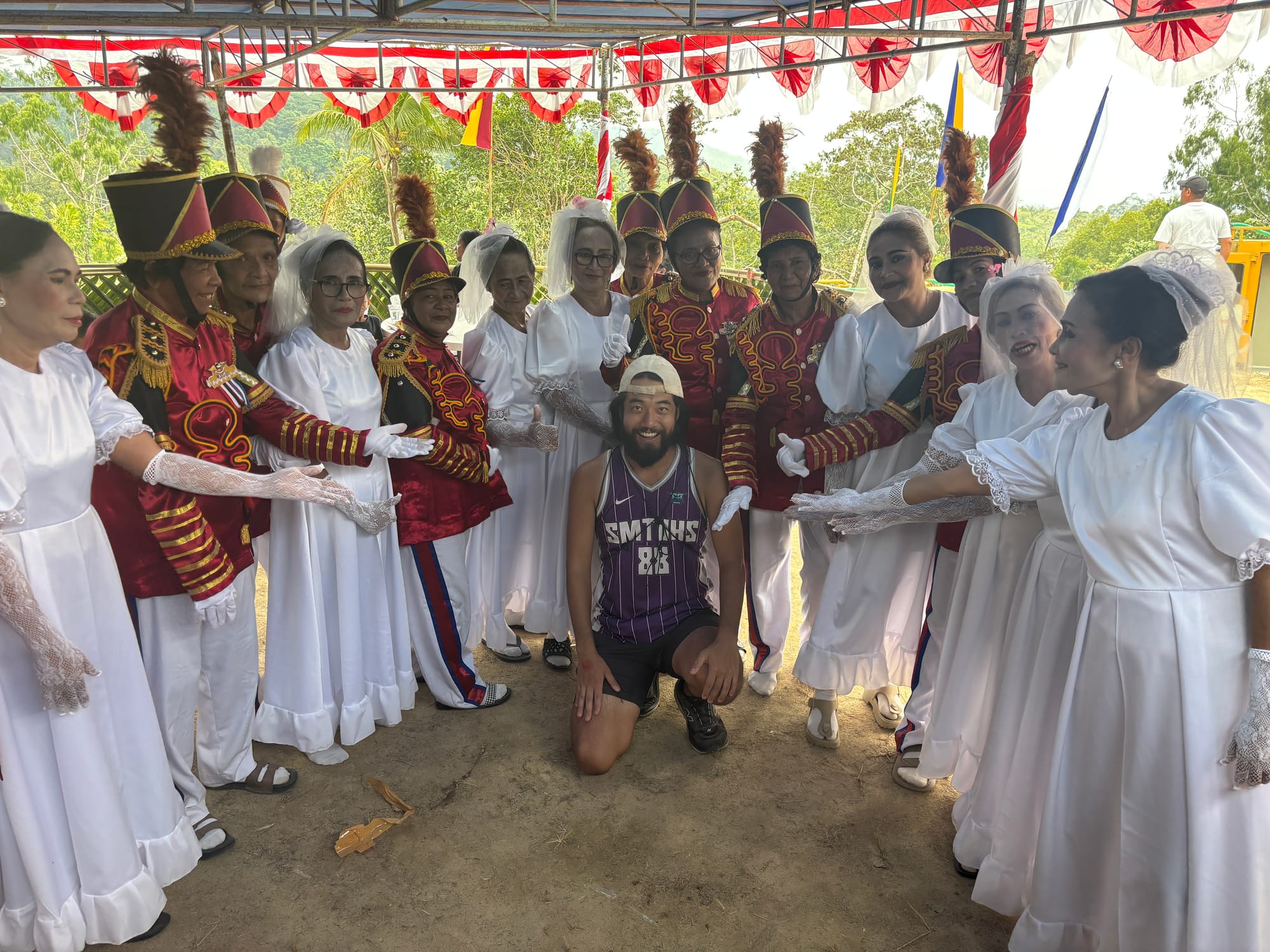 Posing with the Tari Lenso performers dressed in formal white outfits