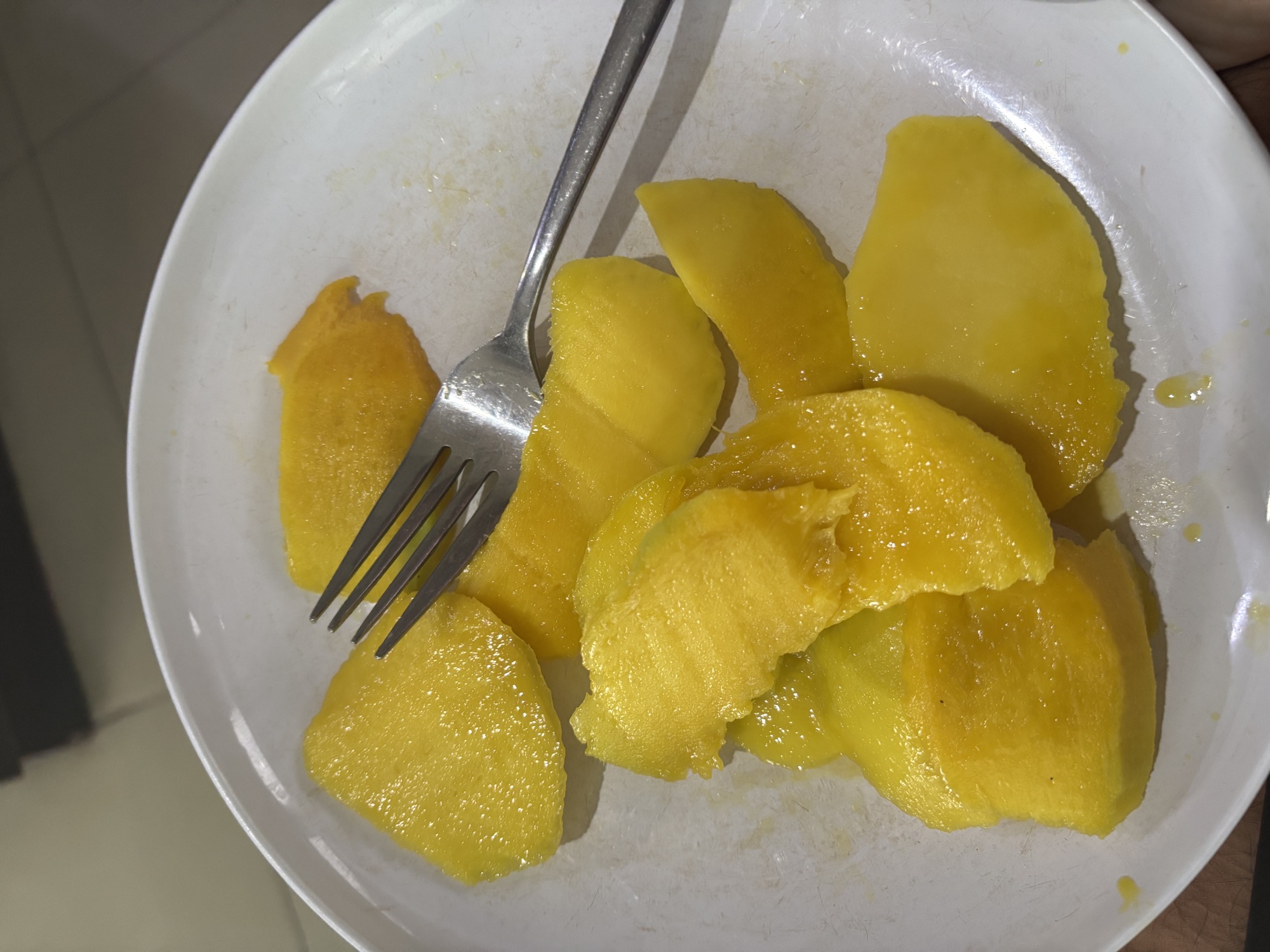 A Kueni, a local Sulawesi fruit similar to mango