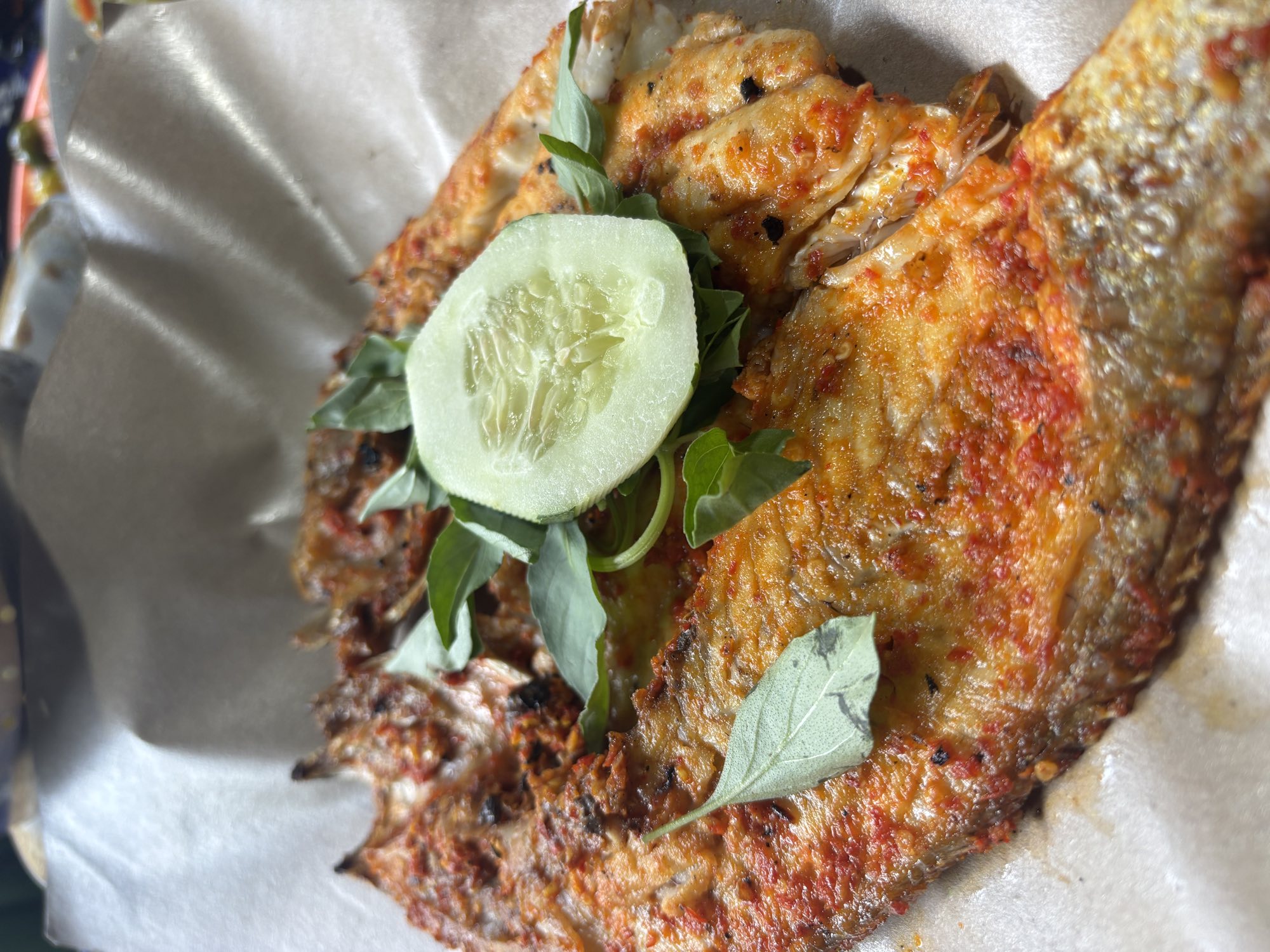 Sulawesi-style grilled dishes covered in red chili sauce
