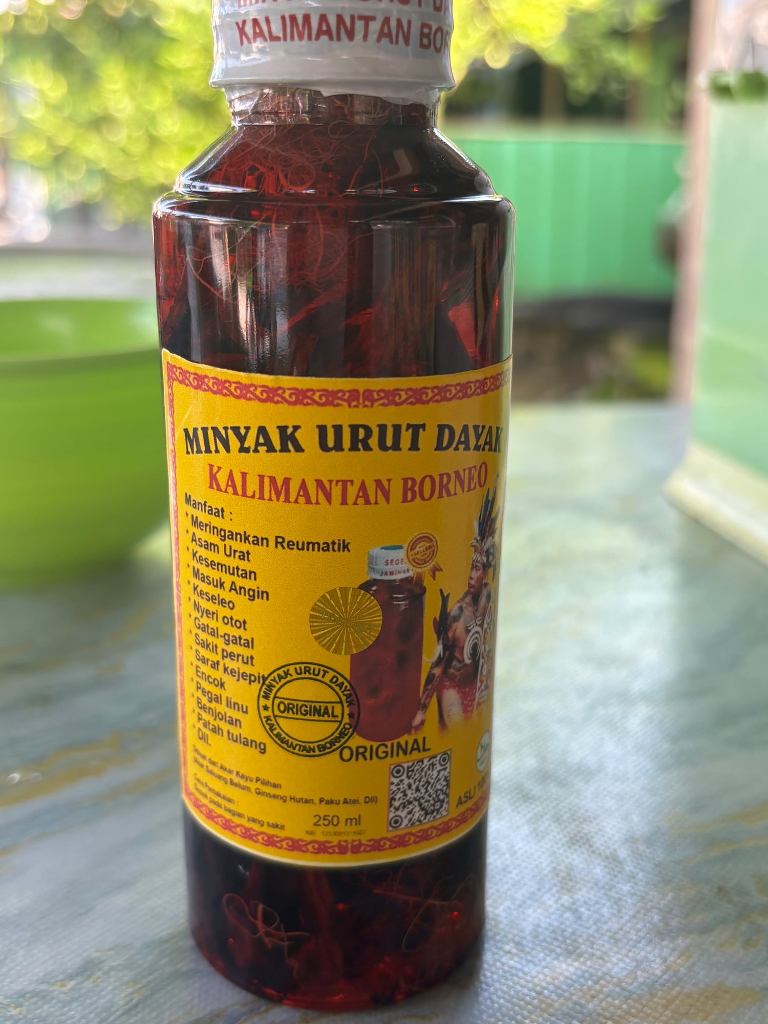 A bottle of traditional Dayak medicinal massage oil from Kalimantan