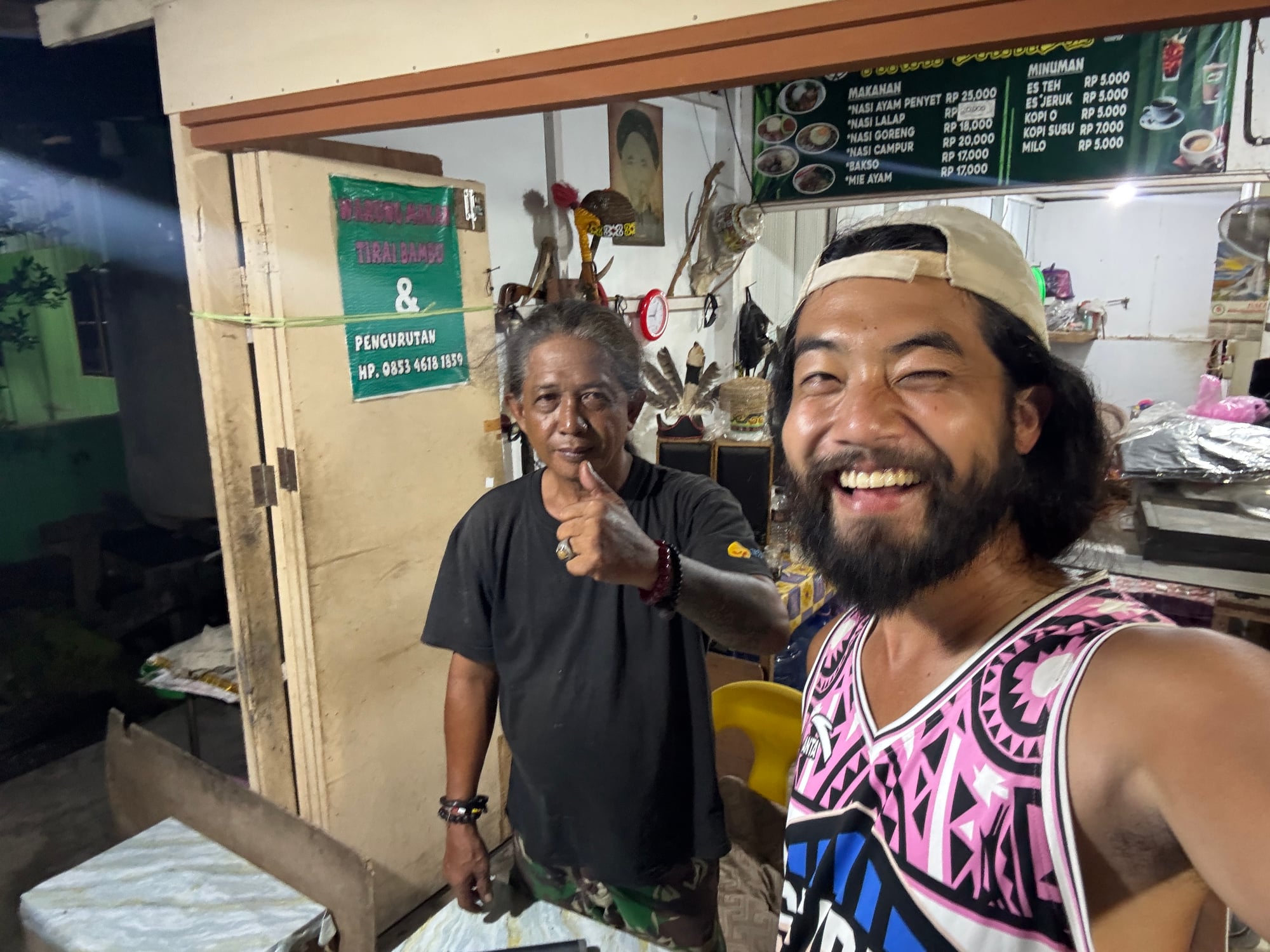 The local man giving a traditional Dayak massage