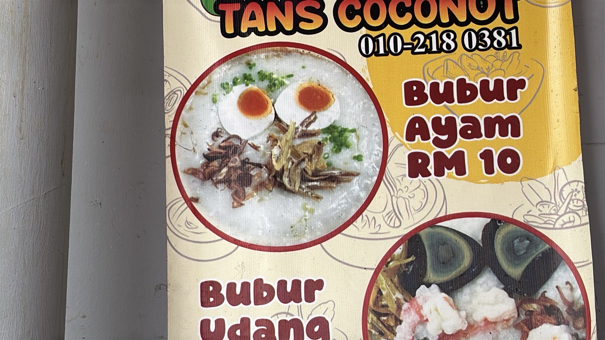 A menu sign advertising Bubur Ayam for RM 10