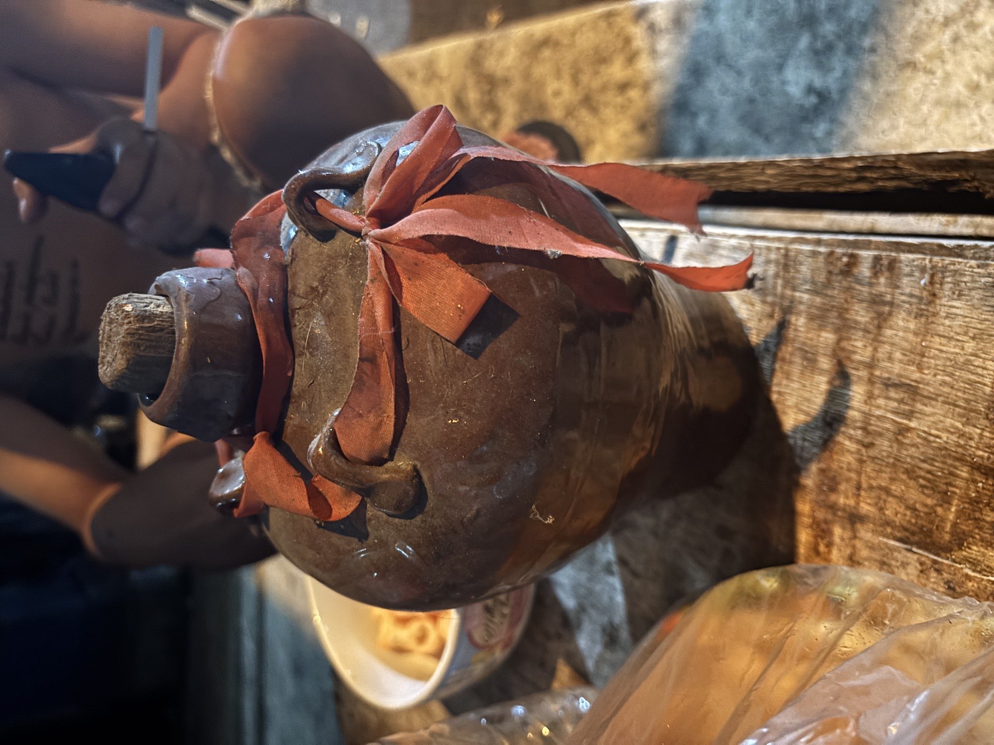 A traditional clay bottle of Cap Tikus, the potent local spirit