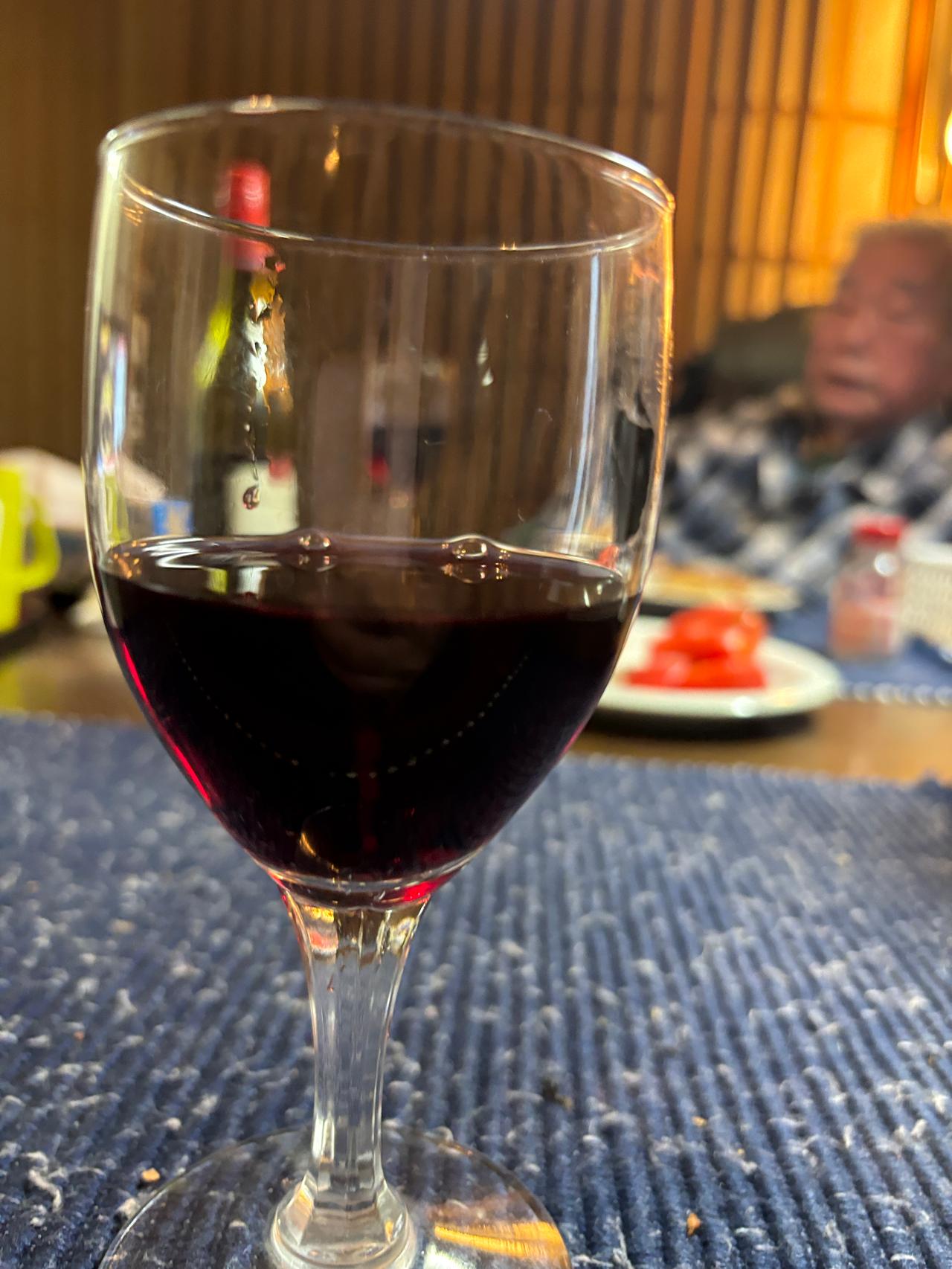 A glass of wine shared with grandpa late at night while watching the 2010 World Cup.