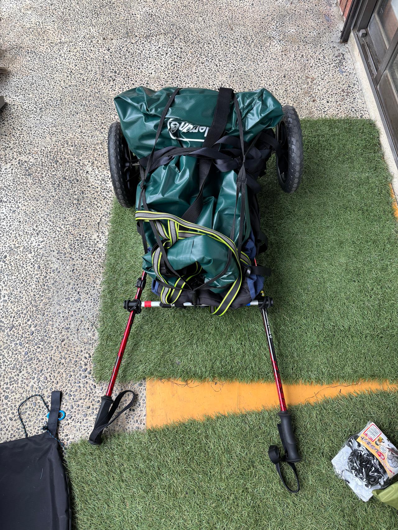 A bicycle with a trailer attached, assembled and ready for the big trip.