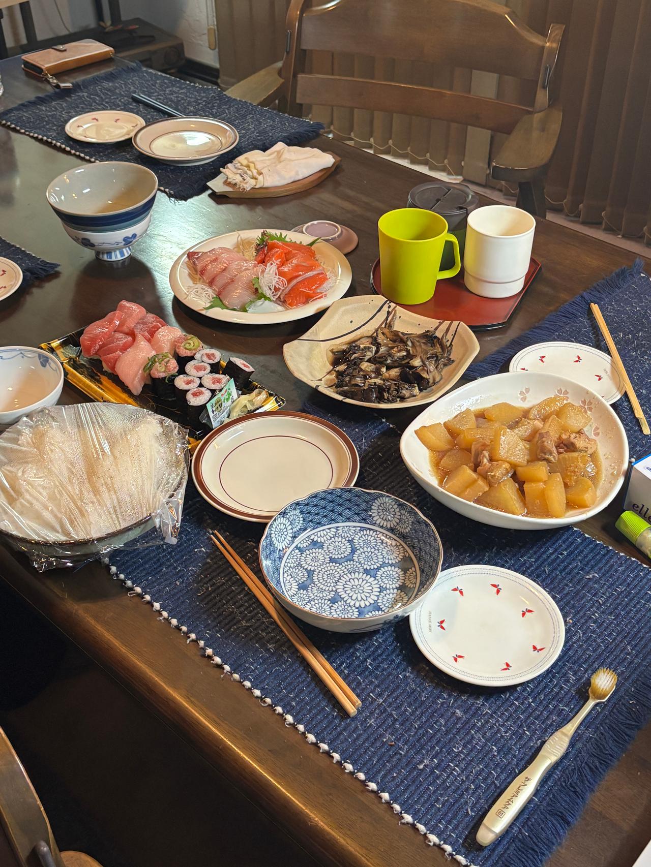 A dinner spread enjoyed at home, a simple but meaningful meal before departure.