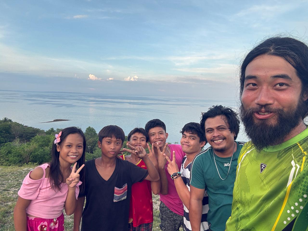 Sharing a moment with other villagers up on the hill in Malapay