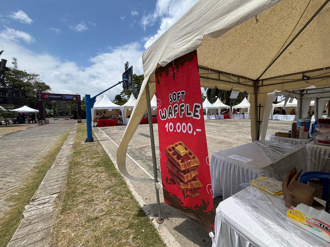 A "Soft Waffle" sign at a park food stand