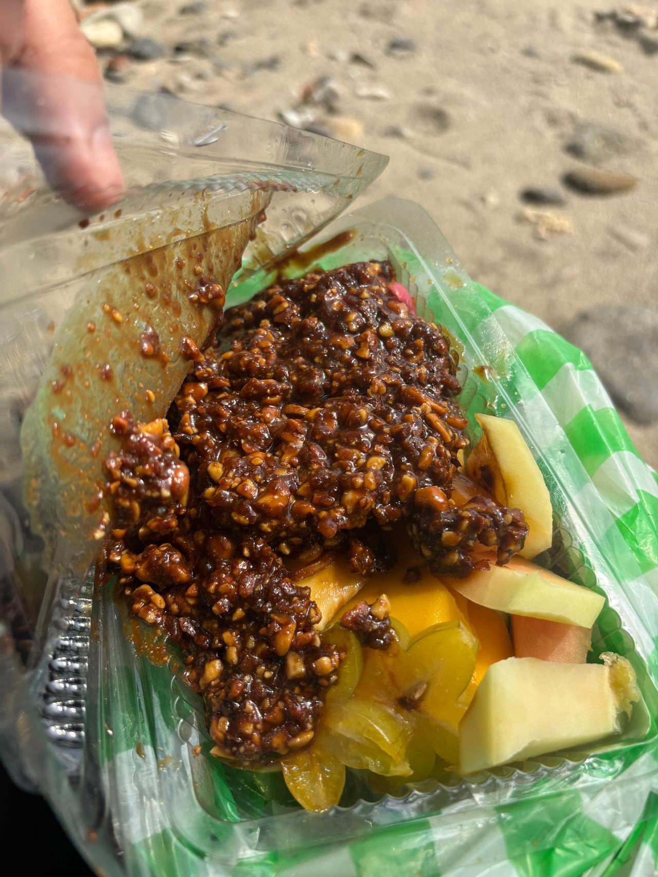 Rujak, mixed fresh fruit covered in sweet and spicy peanut sauce