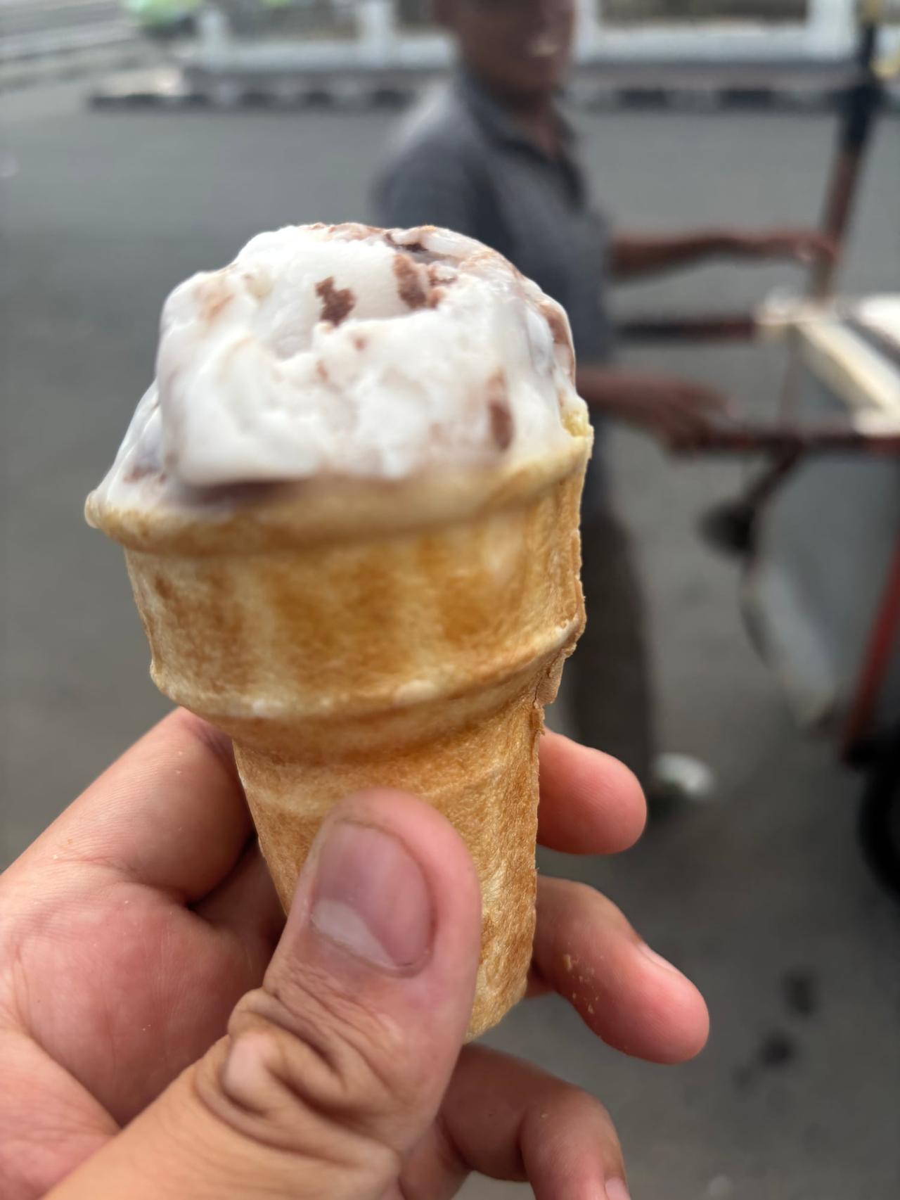 A cone of Es Puter, traditional coconut milk ice cream