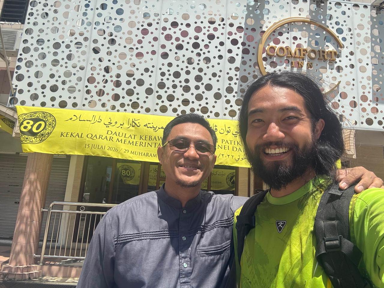 Posing with Yazdi, a local Bruneian driver, outside a hotel