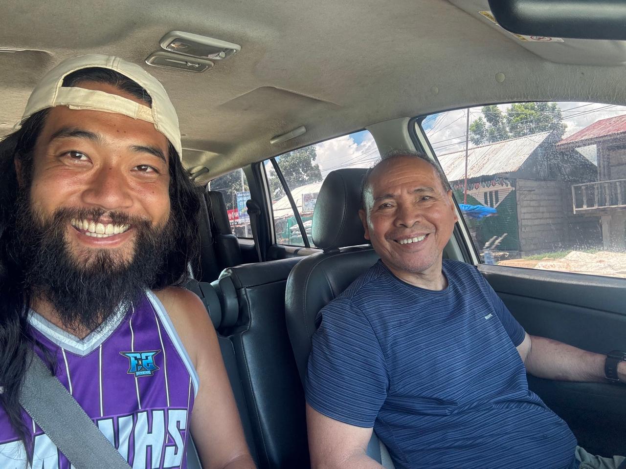 Sharing a smile with a host father inside a car during a morning tour of San Miguel