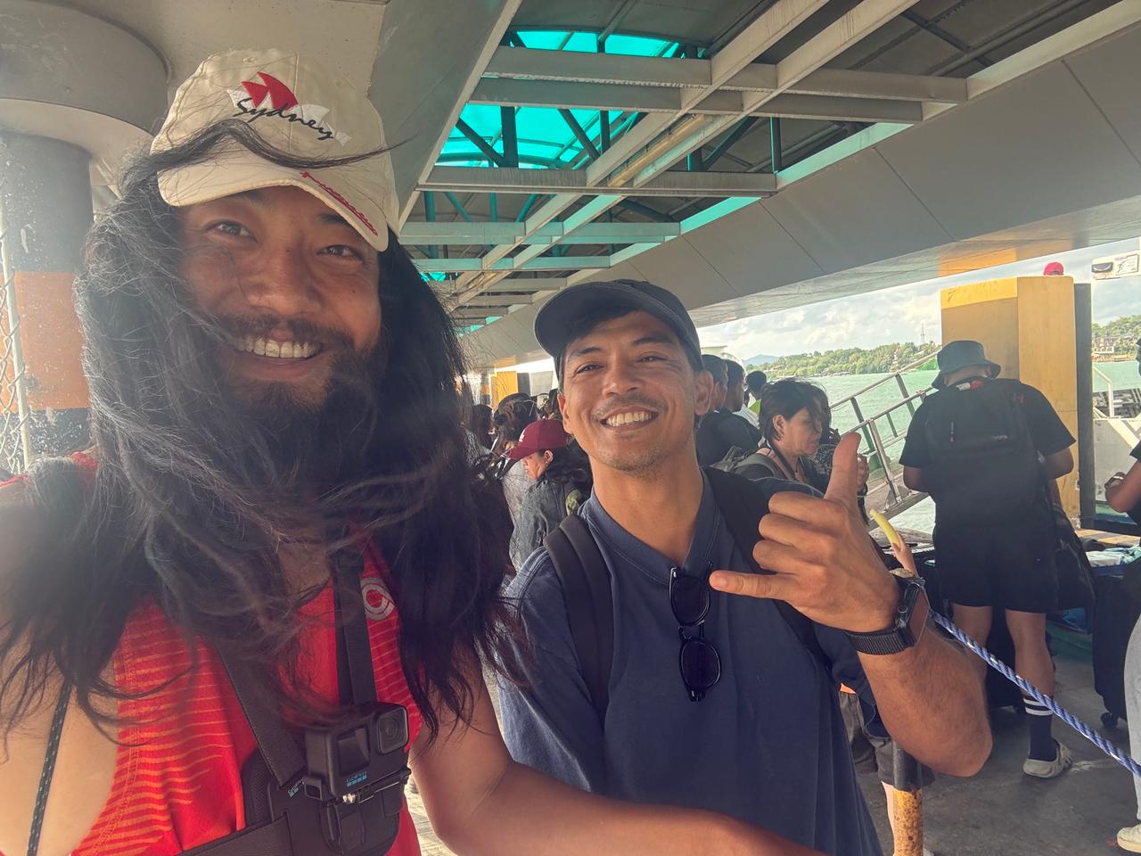 Standing with a friendly local at the ferry terminal in Bohol