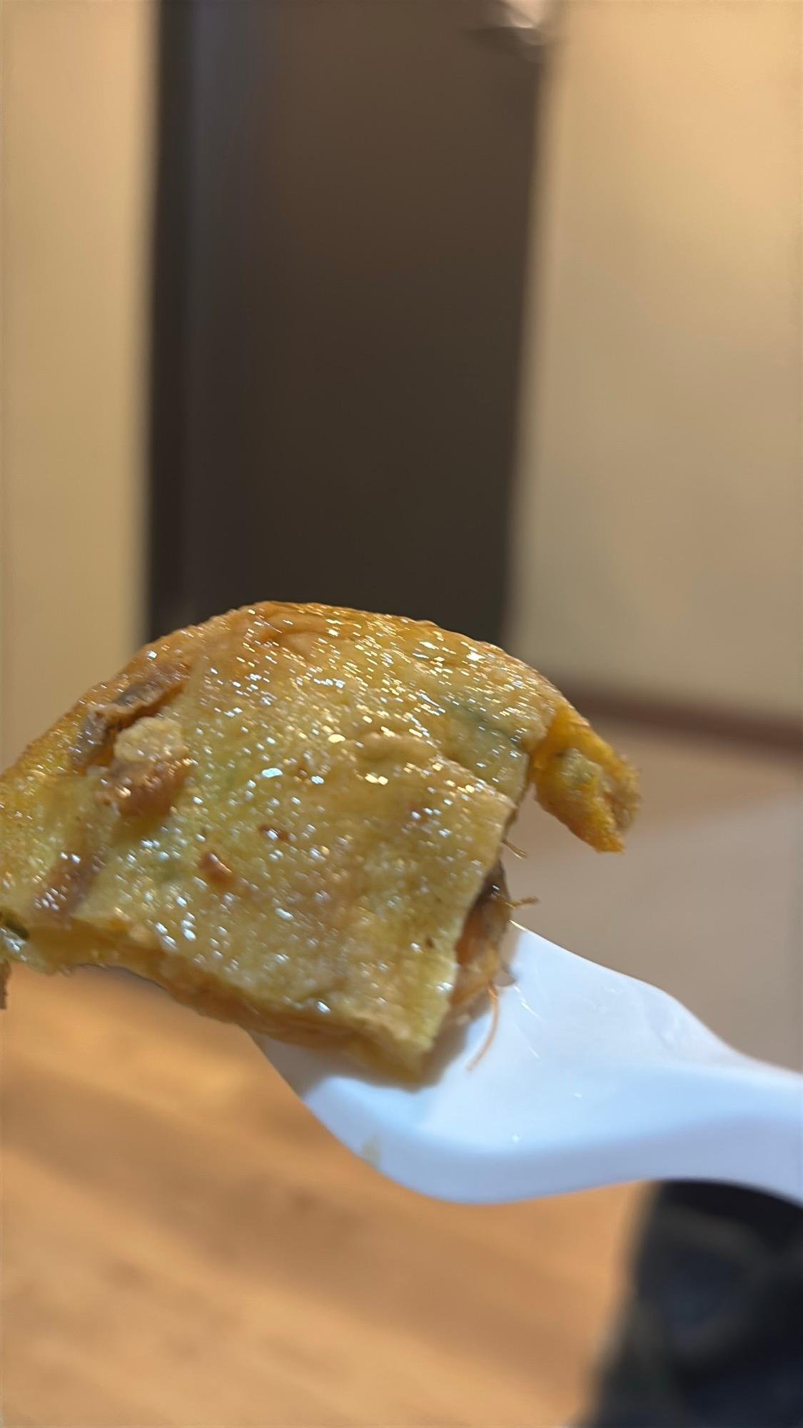 A piece of deep-fried shrimp, known locally as Udang
