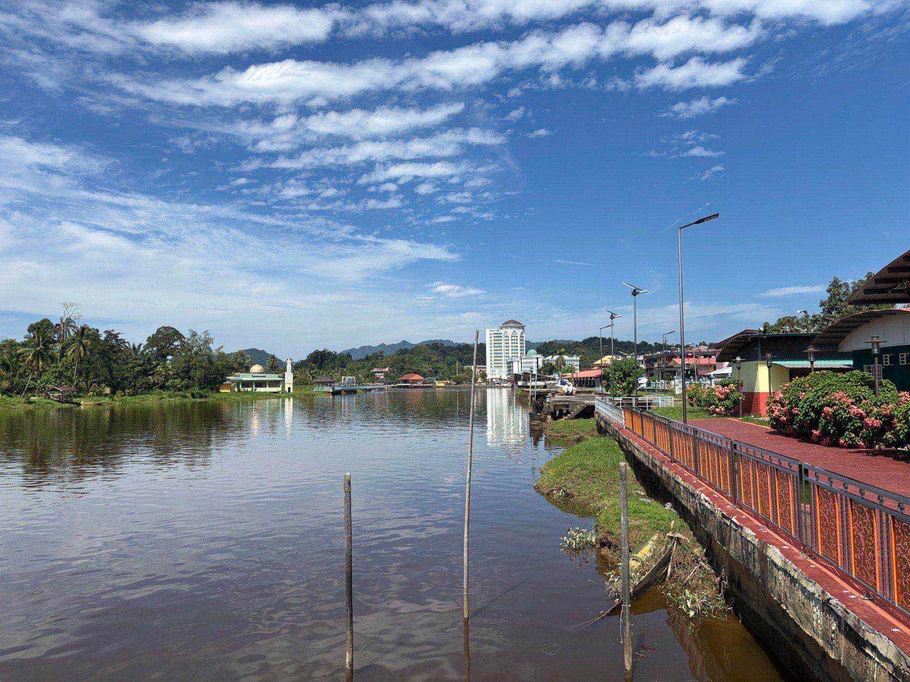 The Lawas riverside promenade with the town skyline in the background