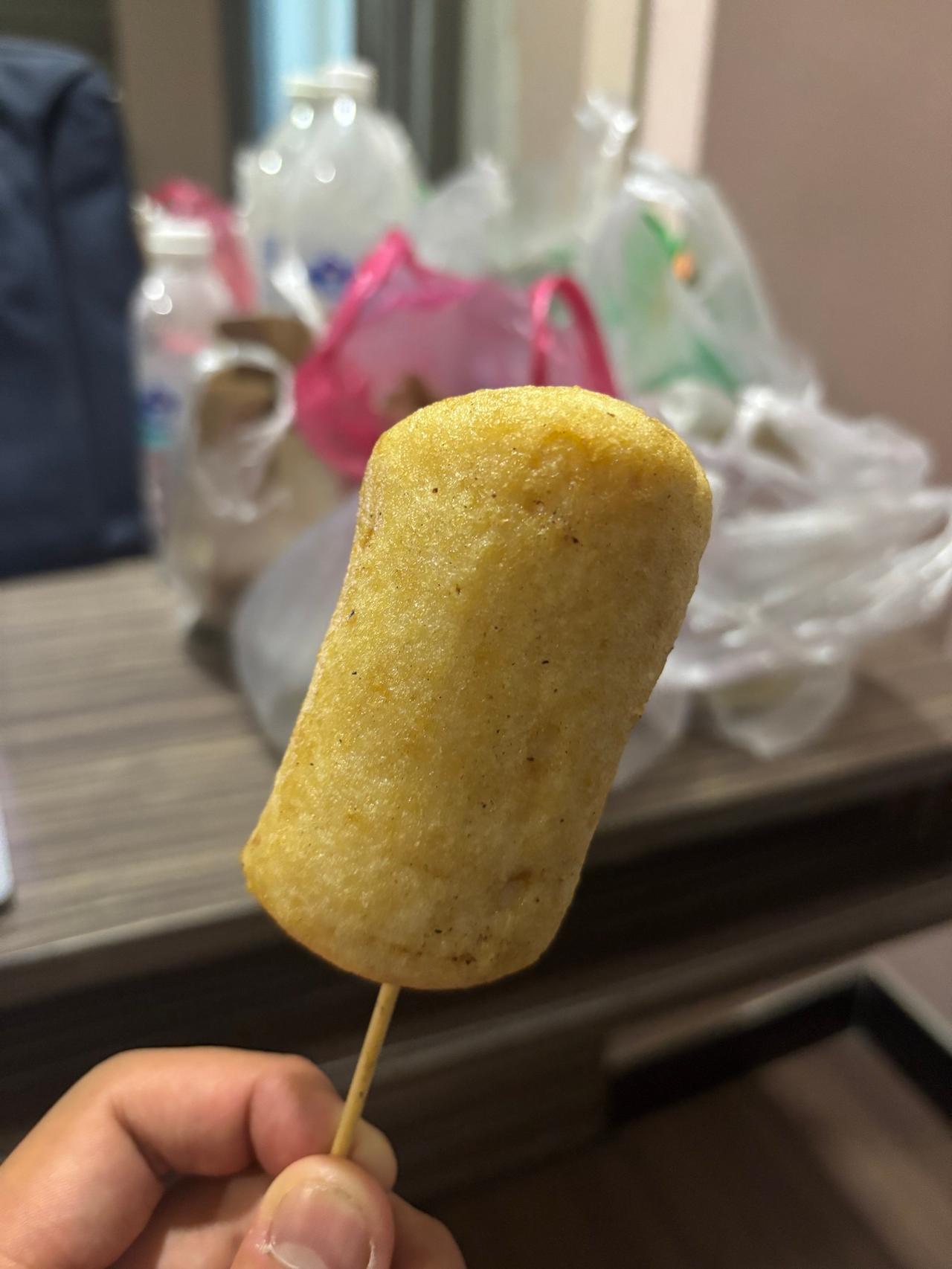 A grilled fish cake skewer, similar to Japanese kamaboko