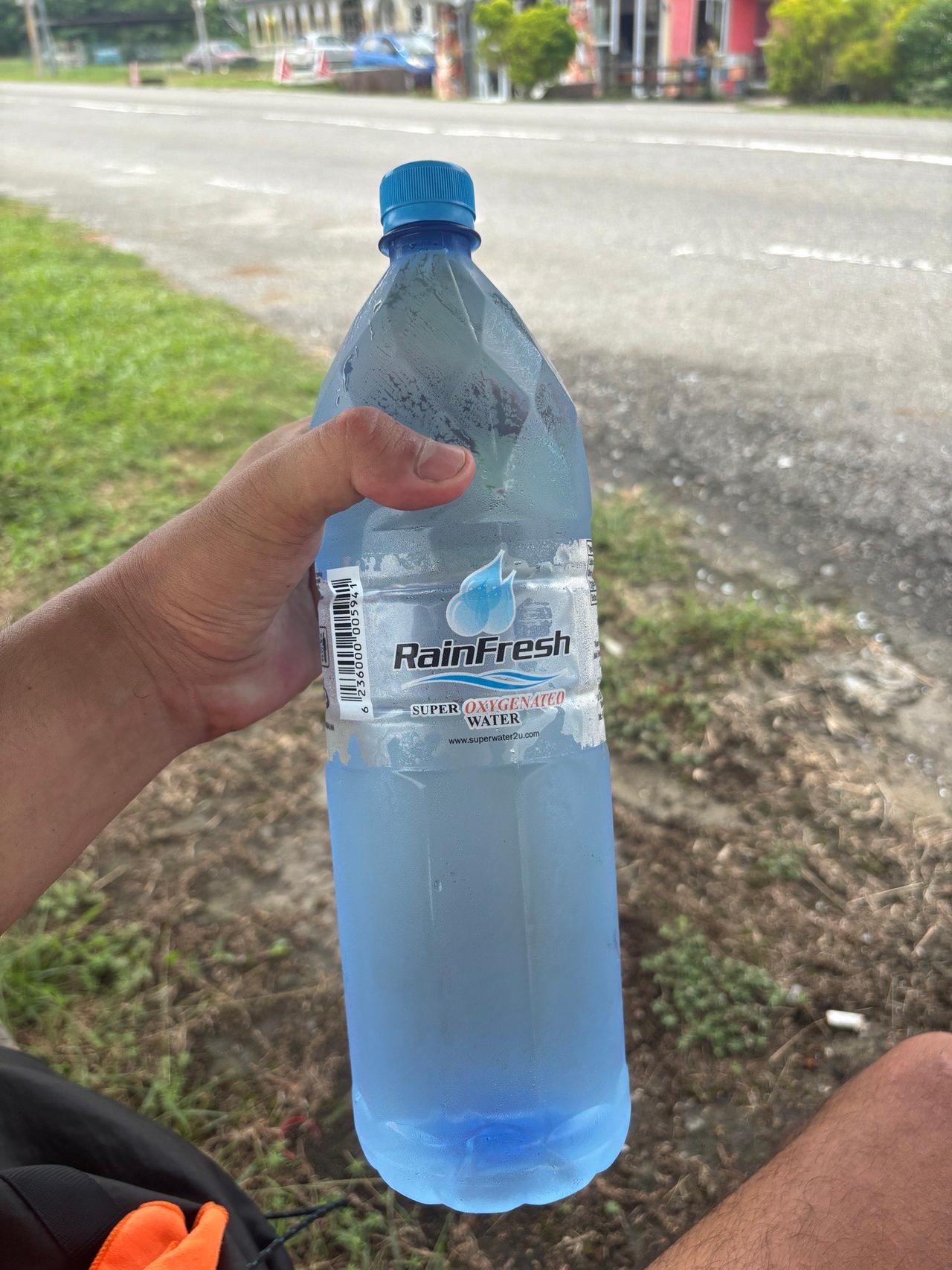 A bottle of water gifted by a stranger just after crossing the border