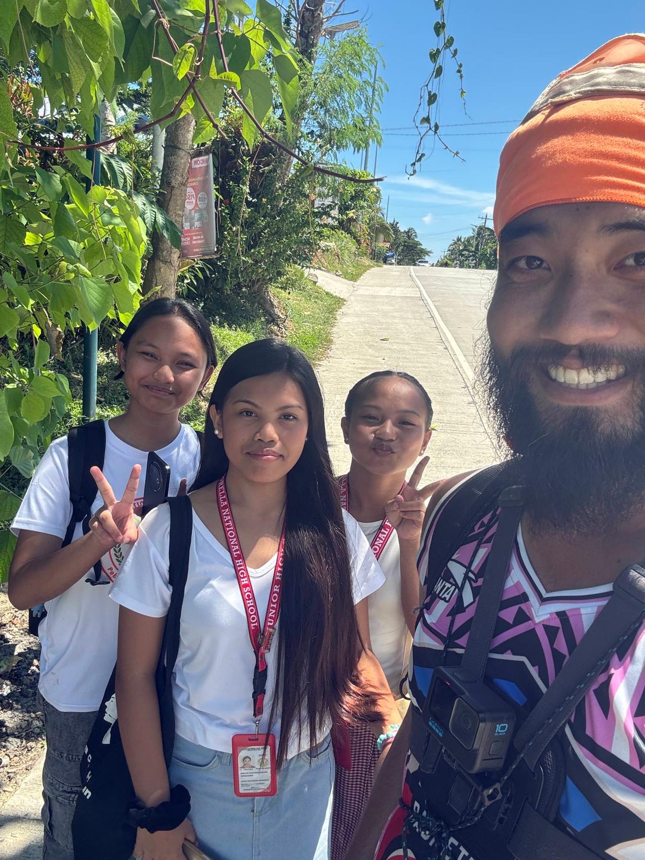 Taking a photo with a group of local high school girls on the road