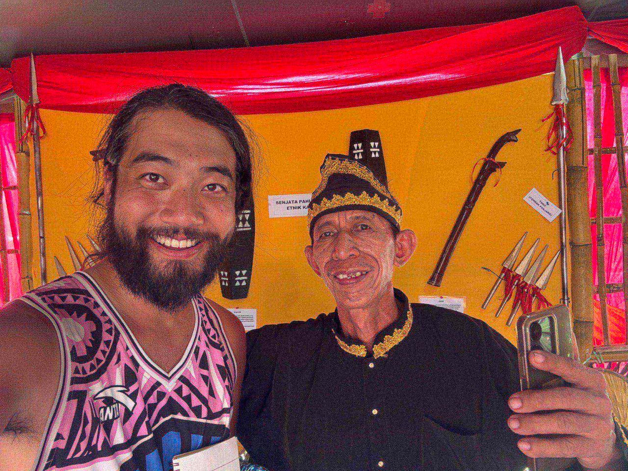 A selfie with a Kaili elder in traditional black and gold attire