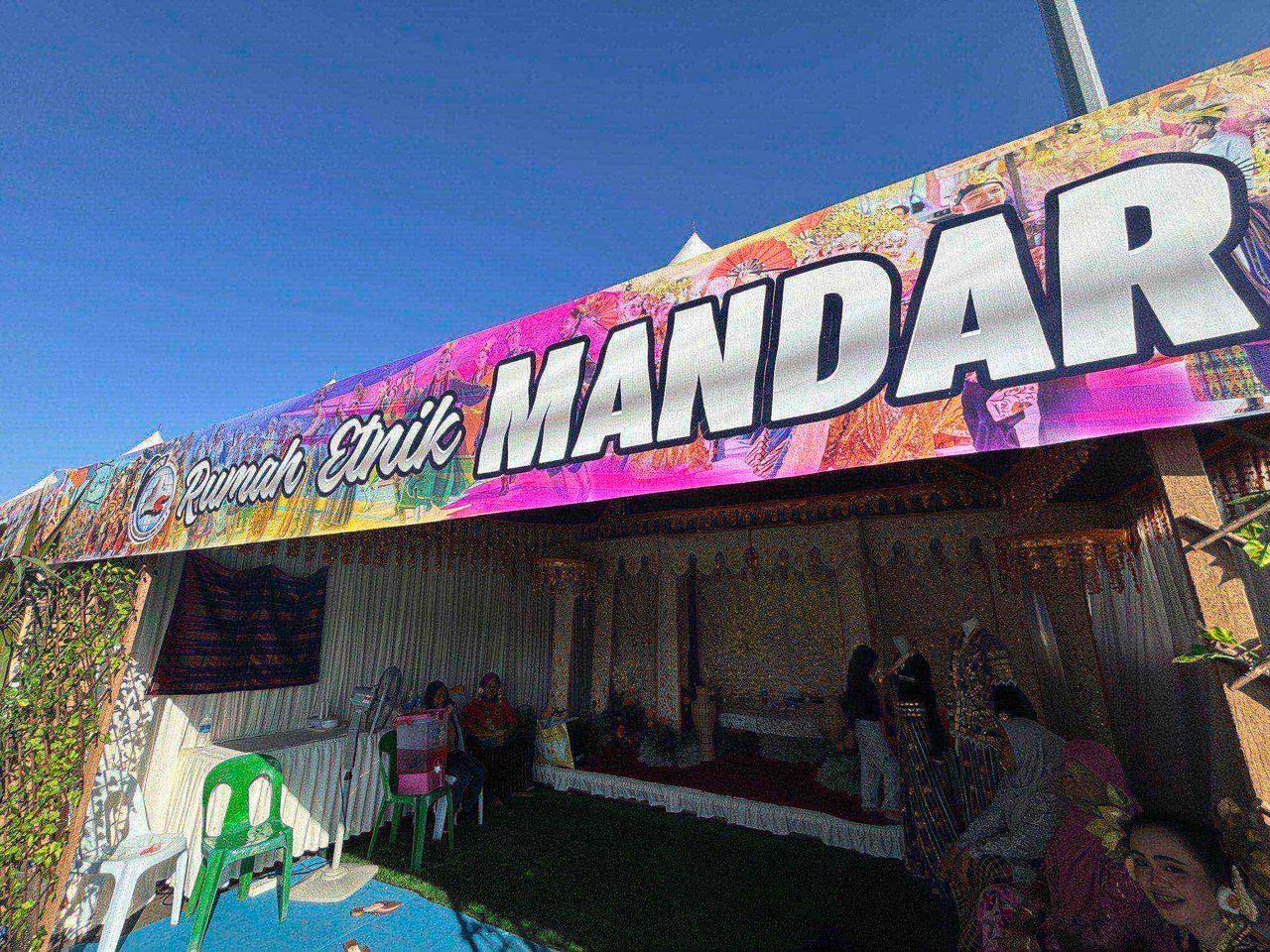 The "Rumah Etnik Mandar" signboard at the festival