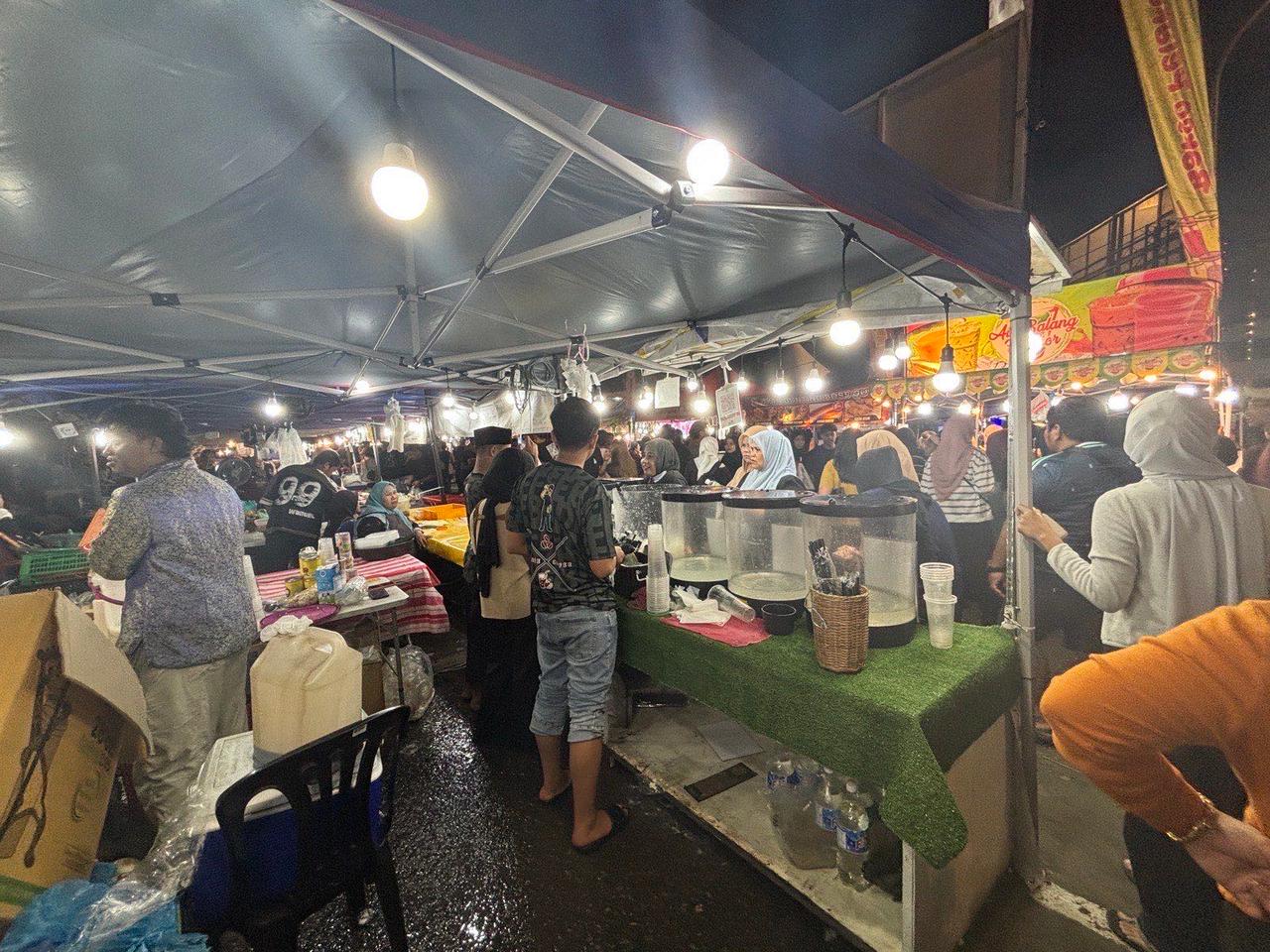 Walking through the packed food stalls of the night market