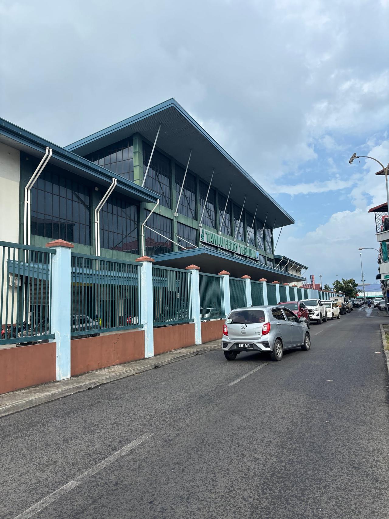 The Tawau ferry terminal building on a bright morning