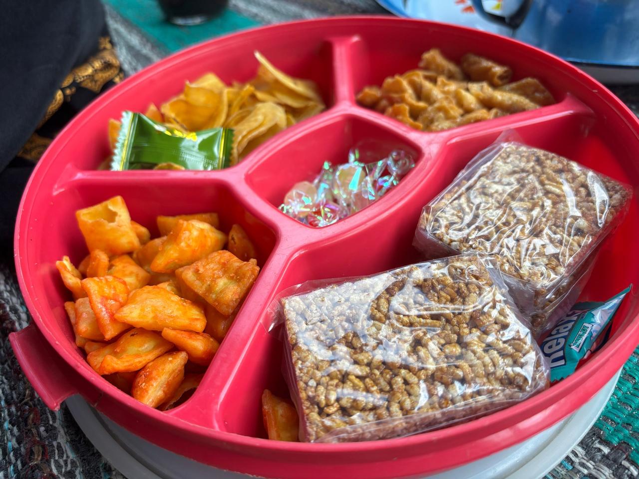 A tray of assorted traditional Torajan snacks and crackers called Kue