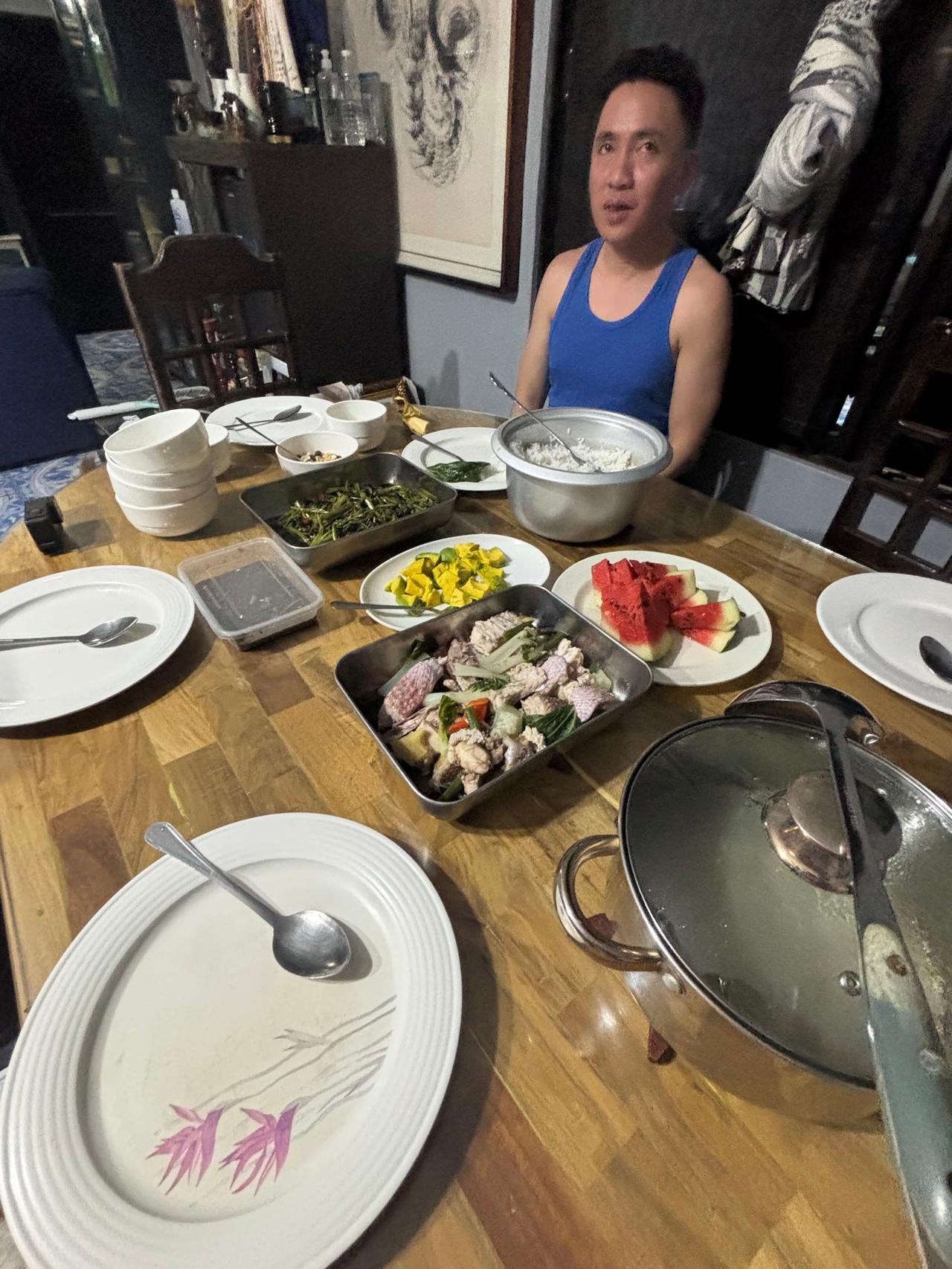 Sitting down to a home-cooked feast with a local family at their dinner table