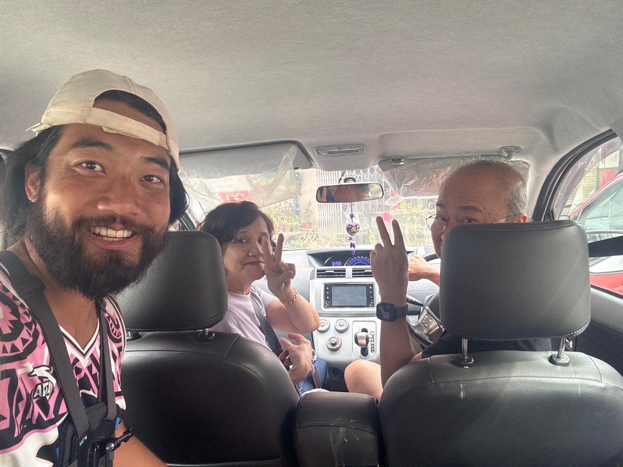 Riding in the car with the couple who offered me a lift toward the Sabah border
