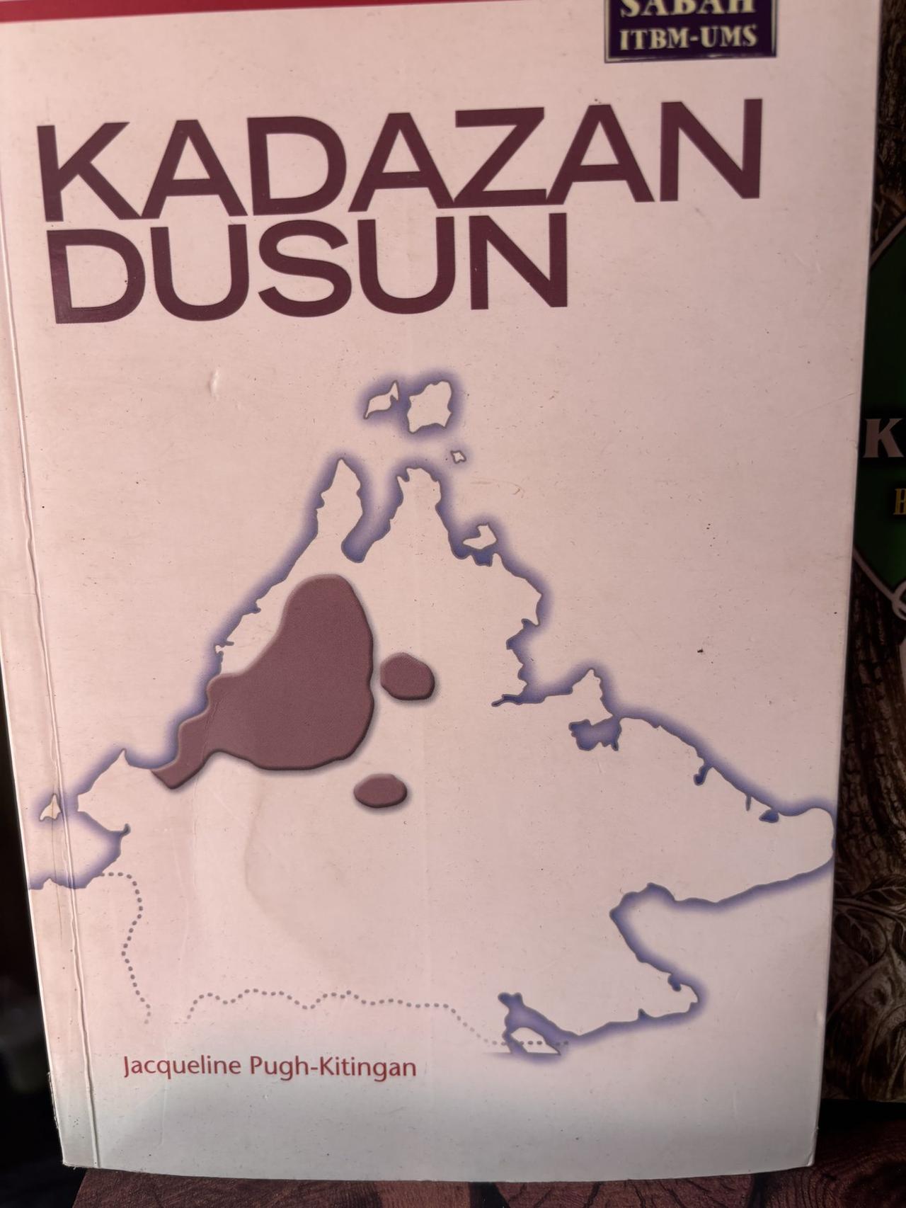 A reference book cover reading Kadazan Dusun by Jacqueline Pugh-Kitingan, showing an outline map of Sabah.
